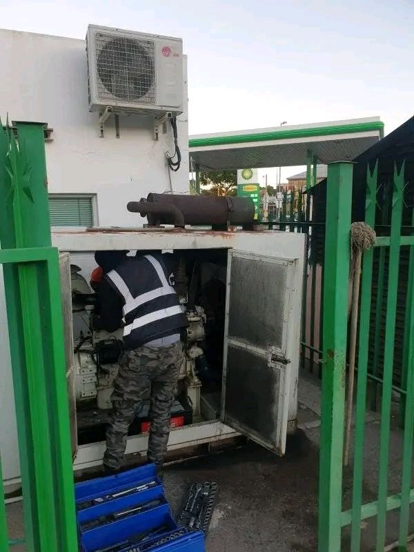 Technician performing a full generator service